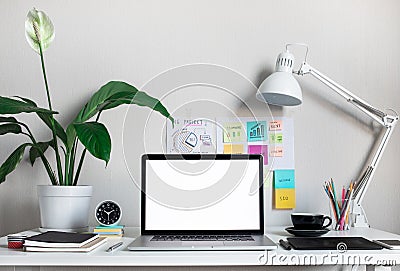 Modern work table with blank computer laptop and accessories in home office studio.Freelance designer or blogger concepts ideas Stock Photo