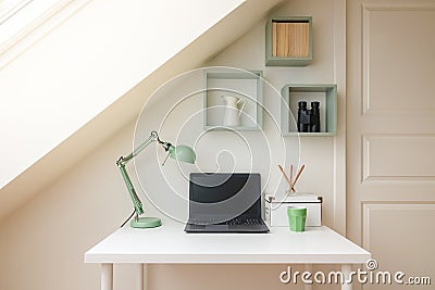 Modern workspace interior in cozy attic / loft apartment. Stock Photo