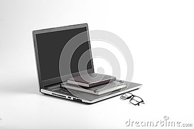 Modern workspace with laptop keyboard, notebook, spectacles on white background Stock Photo