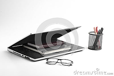 Modern workspace with laptop keyboard, notebook, spectacles on white background Stock Photo