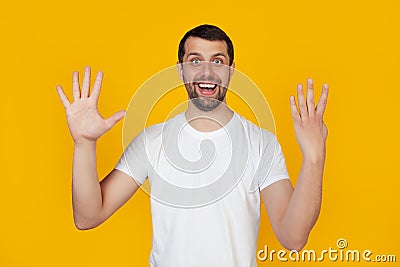 Modern young man with a beard in a white tank top shows number nine with fingers on hand smiling confidently and happily looking Stock Photo