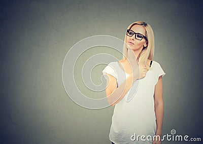 Self confident young woman looking away Stock Photo