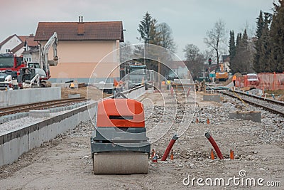 Modernisation of older train station of Domzale, suburb city of ljubljana. Workers laying new tracks with gravel and new Stock Photo