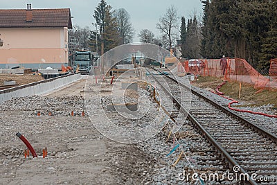Modernisation of older train station of Domzale, suburb city of ljubljana. Workers laying new tracks with gravel and new Stock Photo