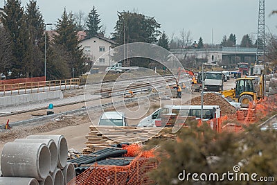 Modernization of older train station of Domzale, suburb city of ljubljana. Workers laying new tracks with gravel and new Stock Photo