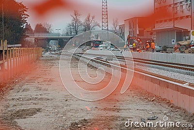 Modernization of older train station of Domzale, suburb city of ljubljana. Workers laying new tracks with gravel and new Stock Photo