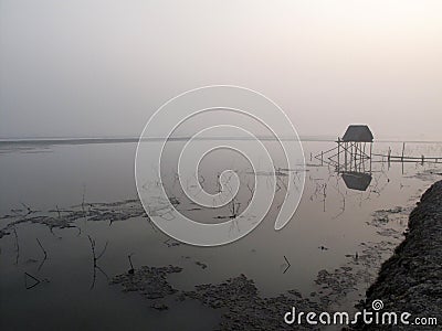 Modest straw hut of Indian fishermen in the Ganges, Sunderband, India Stock Photo