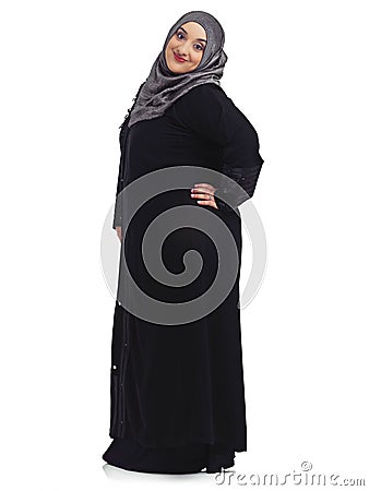 Modesty with a bit of sass. Studio portrait of a young muslim woman isolated on white. Stock Photo