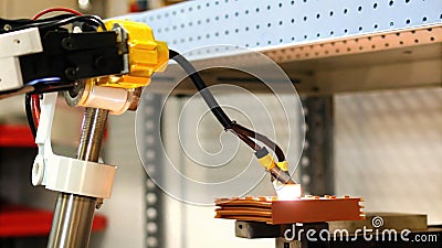 A modular robot equipped with various endeffectors dynamically switching tasks from welding to picking and placing items Stock Photo