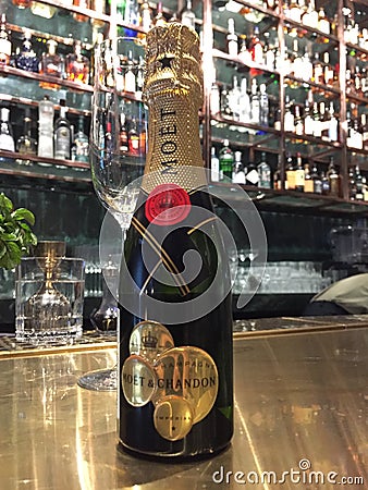 A Moet Chandon Champagne Bottle on a Bar Editorial Stock Photo