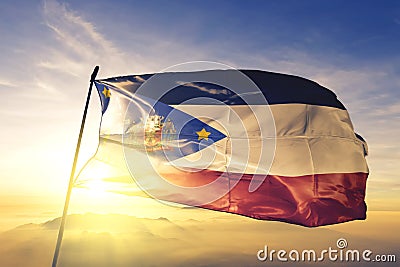 Mogi das Cruzes of Brazil flag waving on the top sunrise mist fog Stock Photo