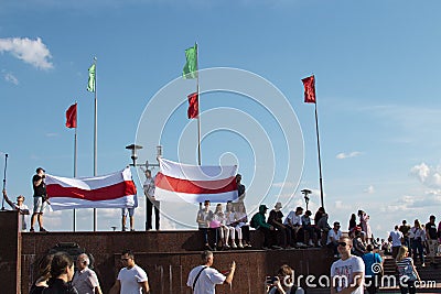 Mogilev, Belarus - August 16, 2020: People at the rally hold flags in the square. Peaceful protest against the 2020 presidential Editorial Stock Photo