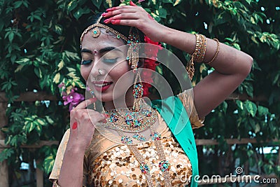 Young pretty lady getting ready with her finger move as classical dance choreography in a practice session Editorial Stock Photo