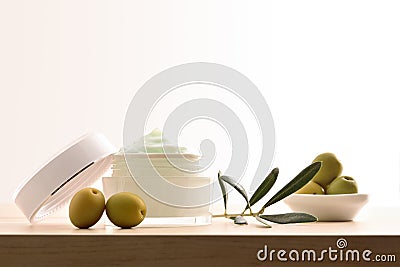 Moisturizing cosmetic cream with olive extract for skin isolated white Stock Photo