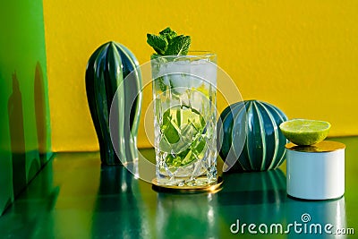 Mojito or mohito cocktail on green background. New modern cocktails drinks design concept Stock Photo