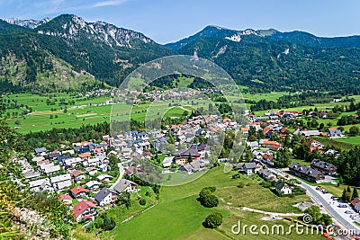 Mojstrana village in Slovenia - aerial view on a bright, sunny day, with Karawanks mountain range visible in the back. Stock Photo