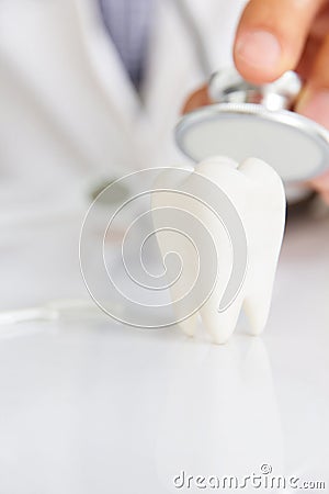 Molar with dentist background Stock Photo