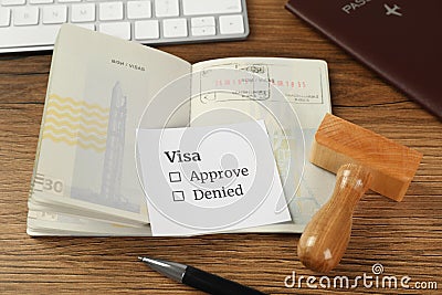 Moldova, Ceadir-Lunga - June 13, 2022: Passport with visa stamps on wooden table Editorial Stock Photo