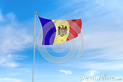 Moldova flag over blue sky background Stock Photo