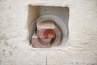 Moldy stone wall through damp walls structure photographed in daylight Stock Photo