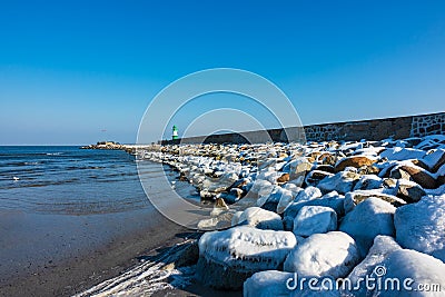 Mole in winter time in Warnemuende, Germany Stock Photo