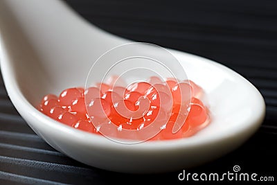 Molecular melon caviar balls Stock Photo