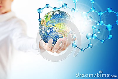 Molecules and globus in hand, Molecular medical, ecology abstraction in hand. Virus and planet Earth. Molecule and atoms Stock Photo