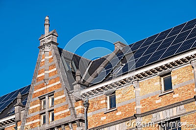 Molenbeek, Brussels Capital Region, Belgium - Historical facade of the Tour and Taxis building with solar panels on the roof Editorial Stock Photo