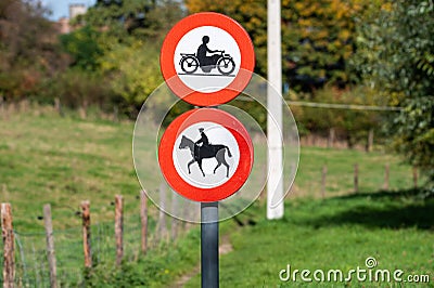 Molenbeek, Brussels Capital Region, Belgium - Warning sign - motorbikes and horses prohibited on a walking trail Editorial Stock Photo