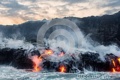 Molten lava flowing into the Pacific Ocean Stock Photo