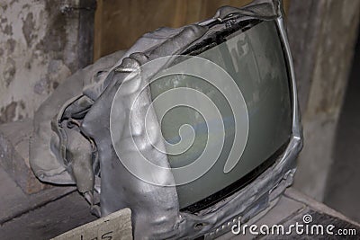 Molten tv set after volcano eruption Stock Photo