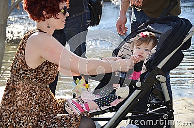 Mom with Baby in Stroller Stock Photo