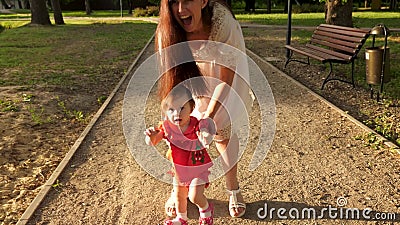 baby walking along furniture