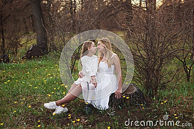Happy family walks in the spring meadow Stock Photo