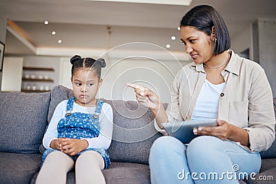 Mom, child and scolding or discipline, tablet and punishment for technology. Parent and daughter, communication and Stock Photo