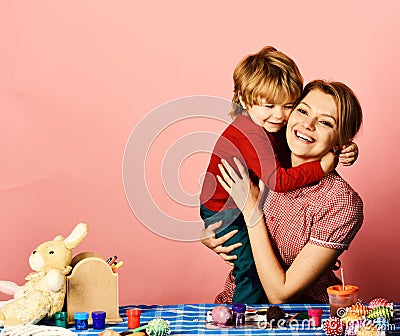 Mom and child spend time together making Easter decorations Stock Photo