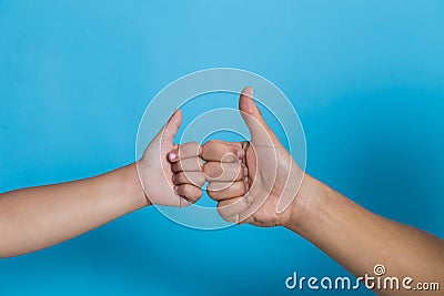 Mom and child thumb up fist together Stock Photo