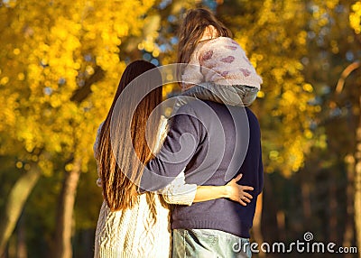 Mom and dad with daughter at sunset in the woods play Stock Photo