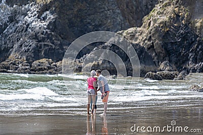 Mom dad and daughter take a selfie on the shore of the Northwest Pacific Editorial Stock Photo