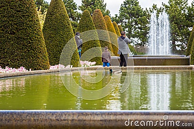 Mom, Dad and their son in the park Editorial Stock Photo