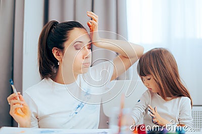 Mom and Daughter getting Paint All Over their Clothes Stock Photo