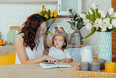 Mom and daughter in the kitchen Stock Photo