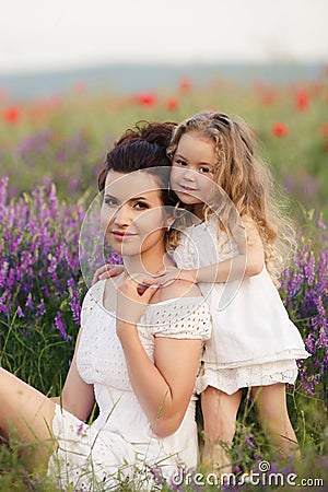 Mom and daughter on a lavender field Stock Photo