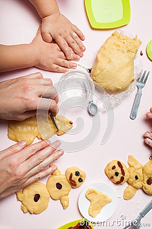 Mom and daughter are preparing for Christmas, cook festive cookies. Snowmen and Christmas trees Stock Photo