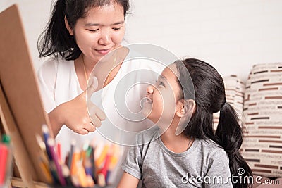 Mom gave a great thumbs-up to her daughter Stock Photo