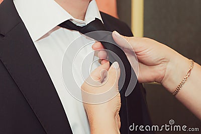 Mom helps her son get ready for the wedding Stock Photo