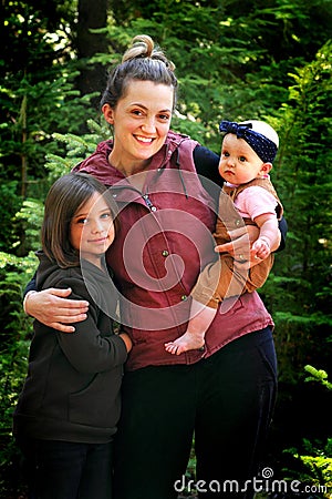 Mom Holds Cute Children Stock Photo