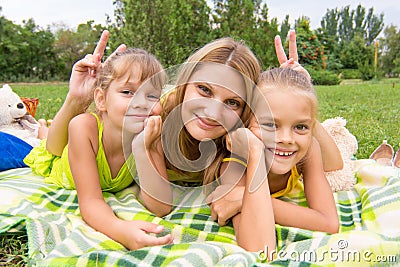 Mom horns and offered two daughters and a fun look into the frame Stock Photo