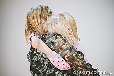 Mom hugs her daughter. Tight hugs mom and daughter Editorial Stock Photo