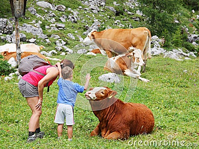 Mom and kid enjoy mountain nature in summer season Stock Photo